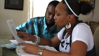 Habitat family reviewing their personal finances