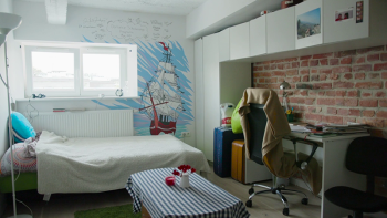 Photo: Michal's studio apartment with a mural of a red ship