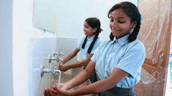 Students in India washing hands