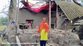 A woman whose home is destroyed by Cyclone Amphan in West Bengal