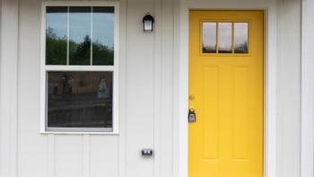 A house with a bright yellow door.