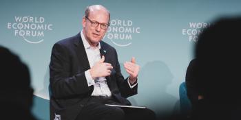 Habitat CEO Jonathan Reckford speaking to a crowd at the World Economic Forum.