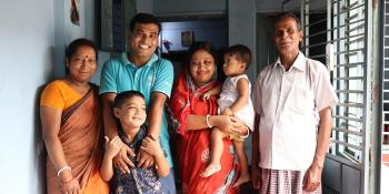 Ashish with his parents, wife and children in their Habitat home in Bangladesh
