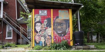 Photo of a colorful mural depicting diverse residents of a community.