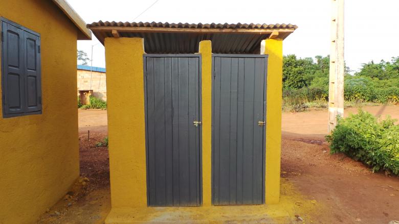 Photo: two ventilated latrines next to a house, Dida-Yaokro, Cote d’Ivoire
