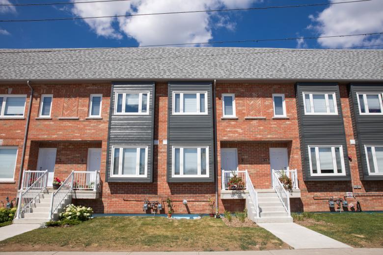 A brick multifamily house in Canada.
