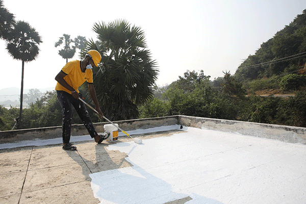 Lokesh Rajkumar, a worker is seen using Excel CoolCoat product  in a house in Chengalpattu. 