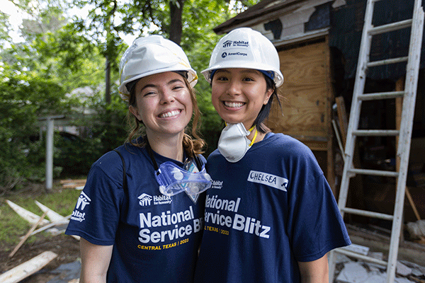 AmeriCorps VISTA member, Special Events employee, based in LA, Della Orr-Harter, and AmeriCorps VISTA member, HFHI Housing and Community Strategies employee, based in Atlanta, Chelsea Lee, smile for the camera
