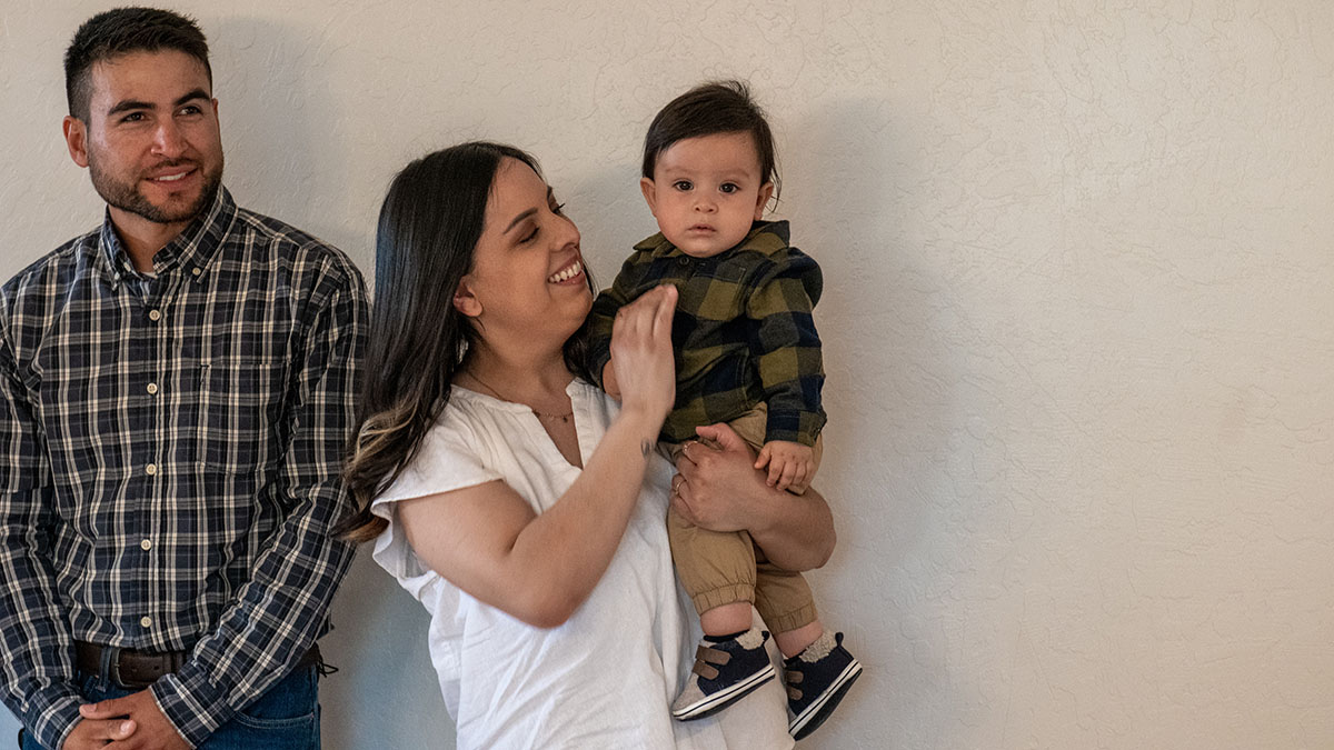 David, Daniela and their son, Mateo, at their home dedication ceremony receiving the keys to their new Habitat home.