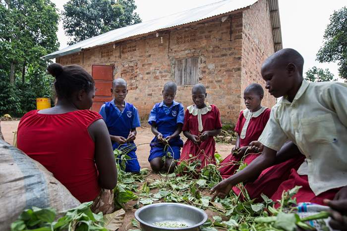 Several of David’s children sit outside the family’s new house. Photo: Habitat for Humanity International / Europe, the Middle East and Africa