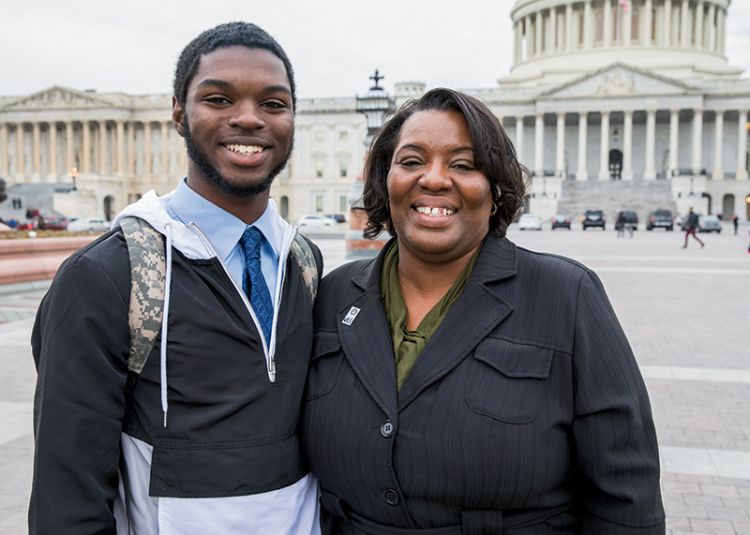 Latasha and her son Christopher stand outside the Capitol building.