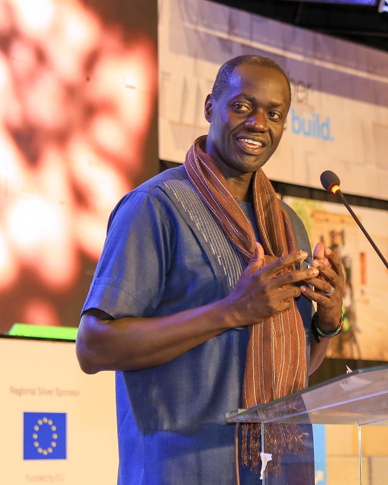 Maurice Makoloo gestures as he speaks at the Housing Forum in May 2022.