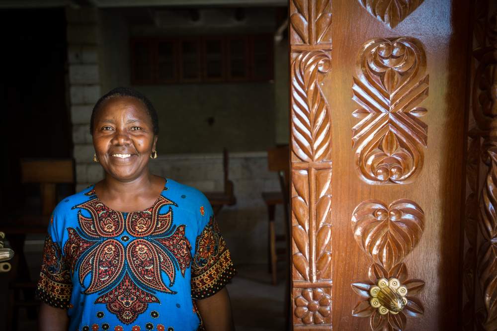 Nditty&#39;s first loan for $50 from KWFT  21 years ago helped her set up a hair salon.