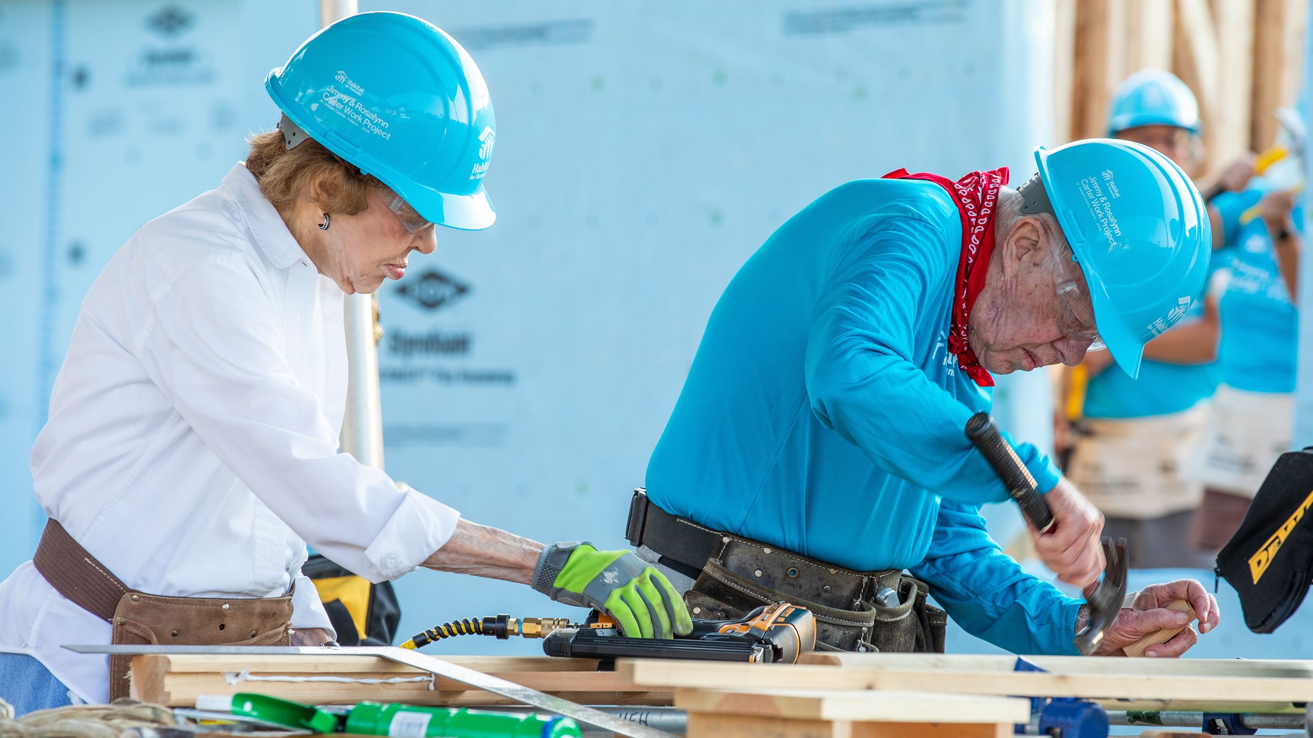 Jimmy and Rosalynn Carter working on a Carter Work Project build site.