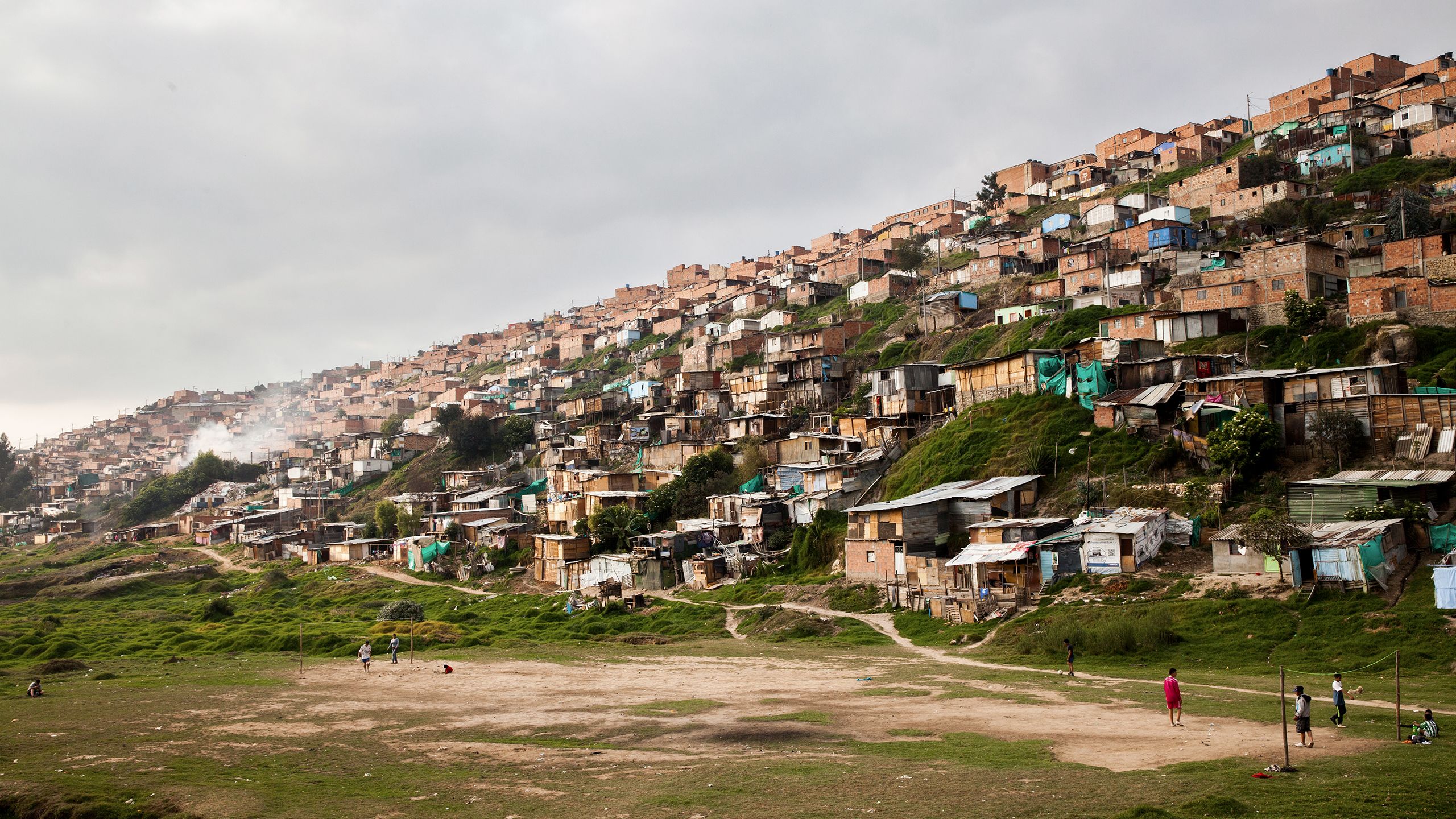 Substandard housing covers a hillside in Soacha, Colombia.
