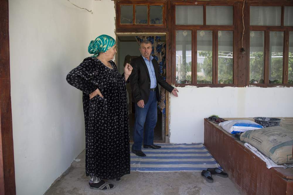 Habitat&#39;s program officer Sai Ali helps women apply for loans and gives advice on how to proceed with construction.