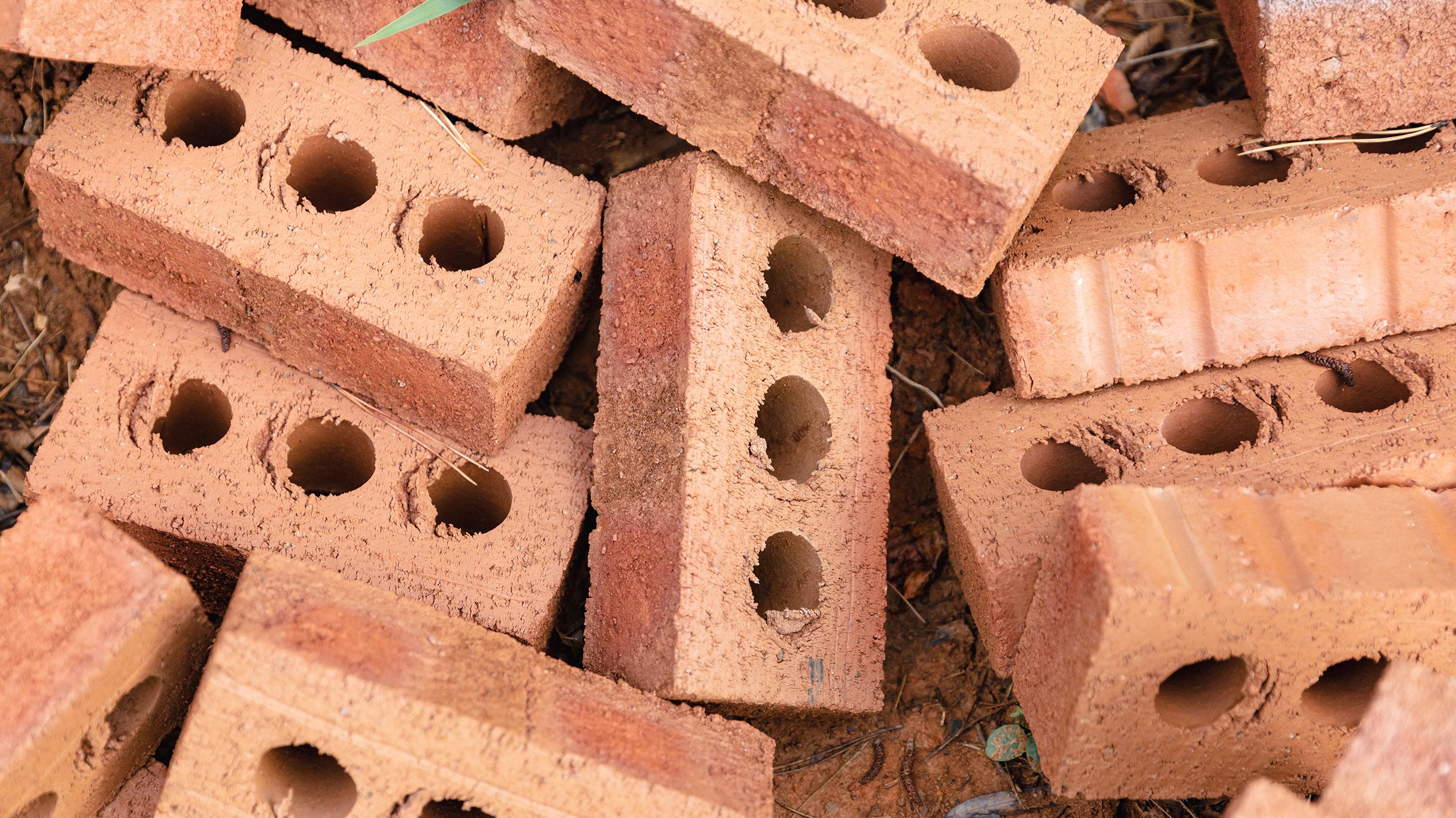 A pile of red clay bricks.