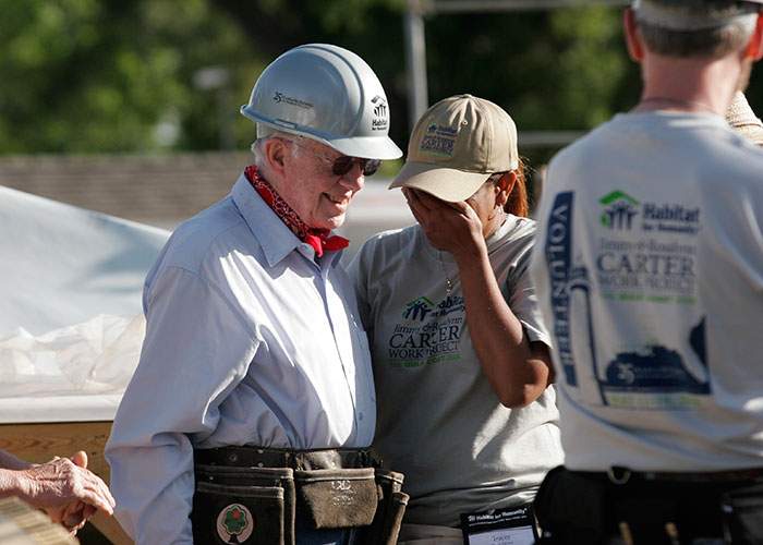 President Jimmy Carter hugs an overcome Tracey Davison at the 2008 Jimmy &amp; Rosalynn Carter Work Project on the U.S. Gulf Coast. “It was all really overwhelming at the time, and it still is,” Tracey says.