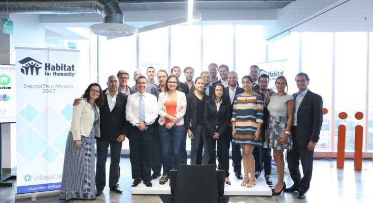 A group of participants stand in a group together.