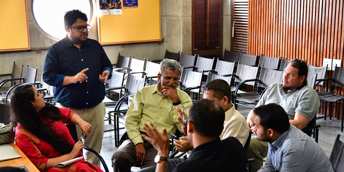 A group of professionals talk.