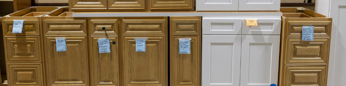 Row of reclaimed cabinets for sale at ReStore.