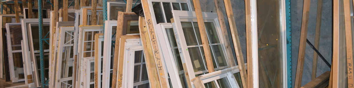 Stacks of salvaged windows at Habitat ReStore.