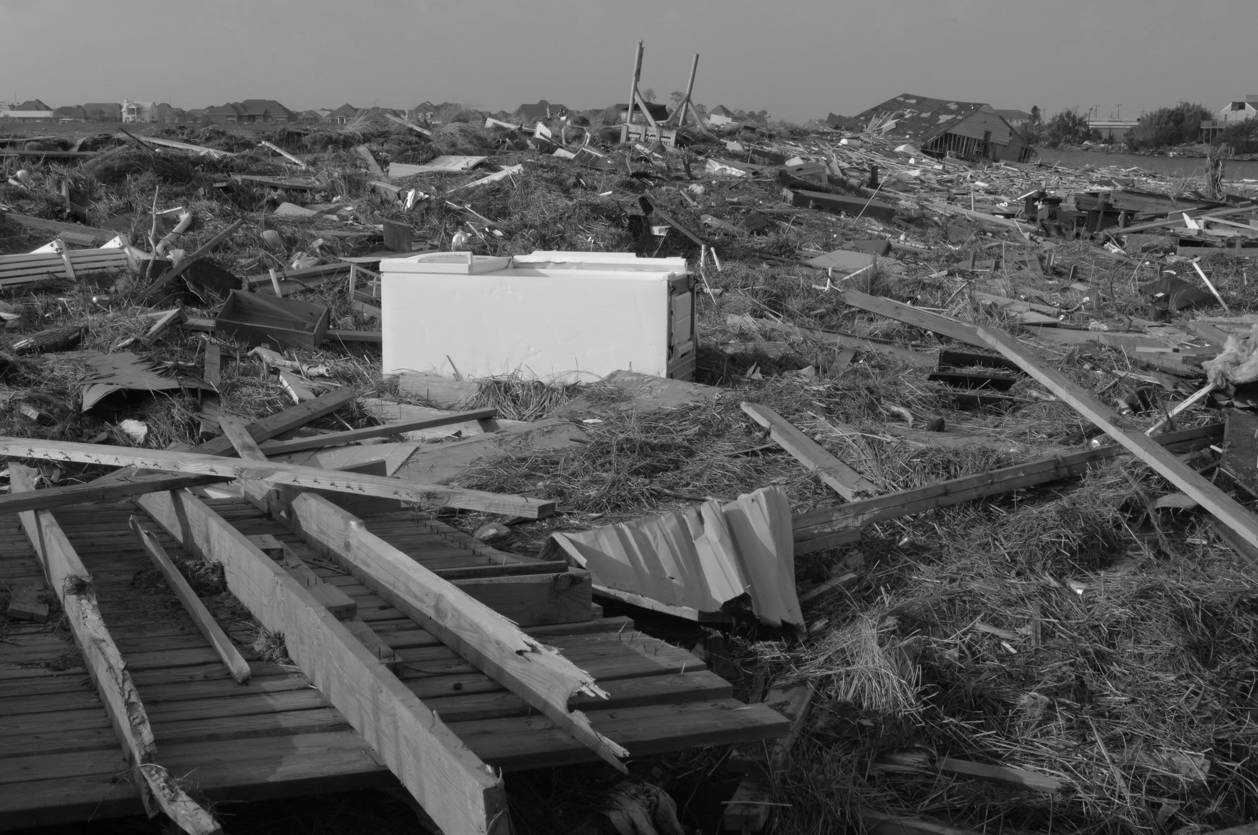 Rubble and debris from Hurricane Katrina stretching from the foreground to the horizon.