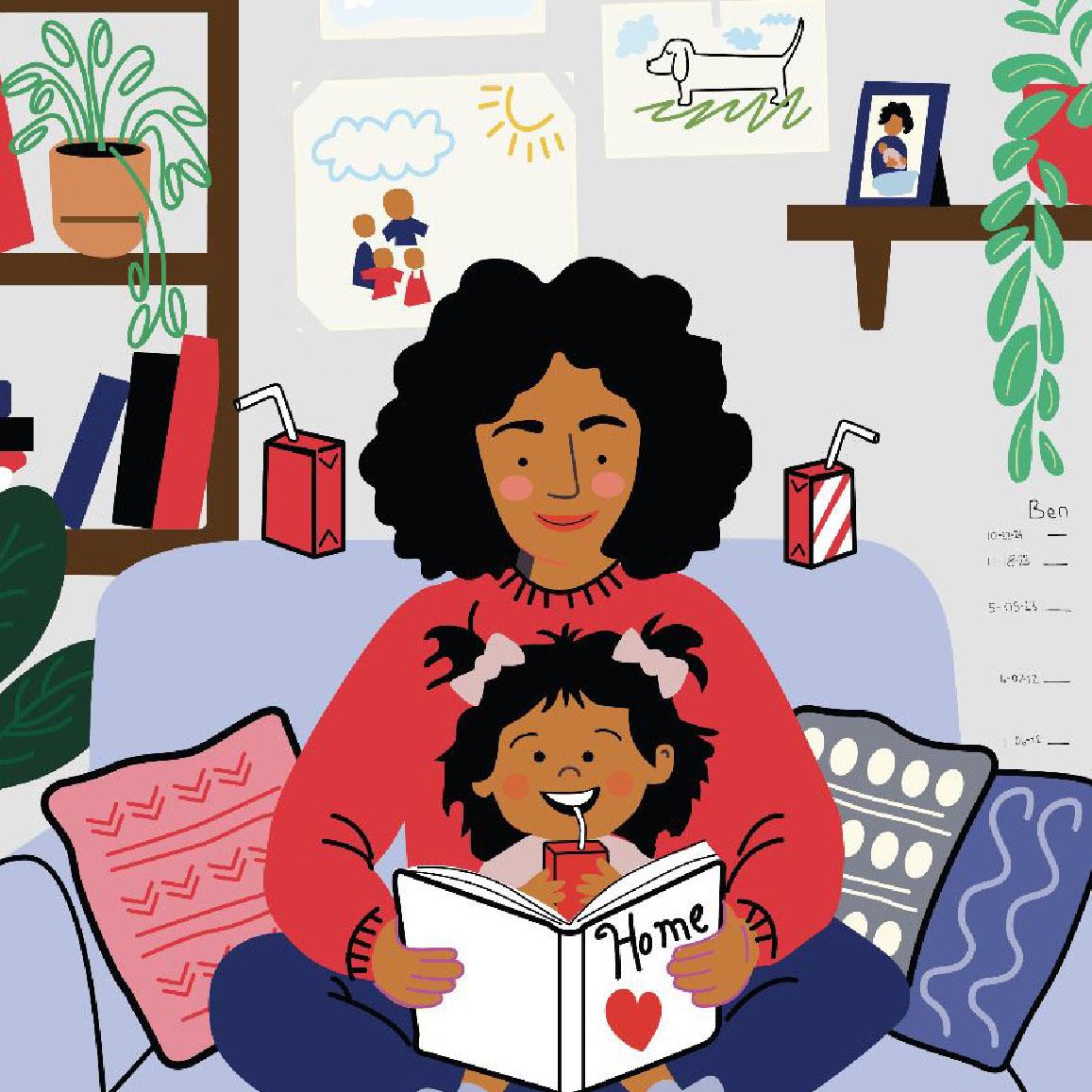 Mom with young toddler reading a book a book on the couch. 