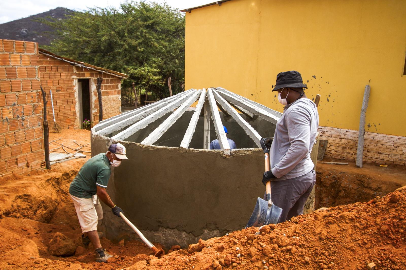Volunteers in Brazil with shovels.