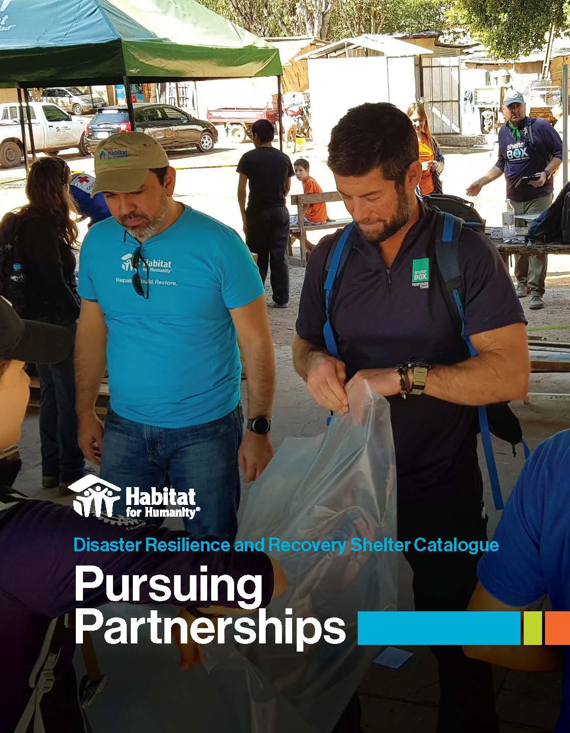 At a disaster supplies distribution center in Paraguay, a man in Habitat-branded clothing and a man wearing a shirt with logo "Shelter Box response team" work together to fold a plastic tarp.