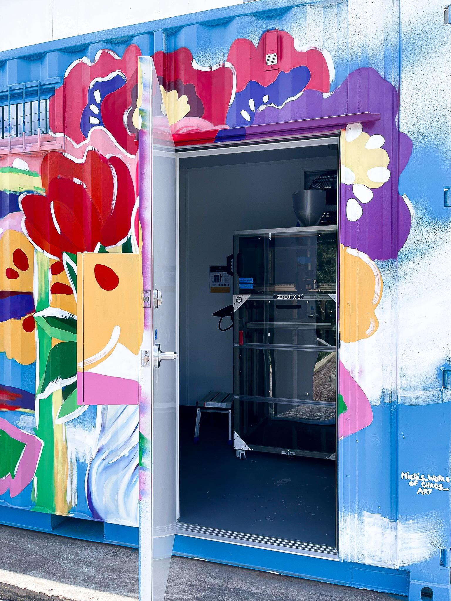 A floral mural on a shipping container.