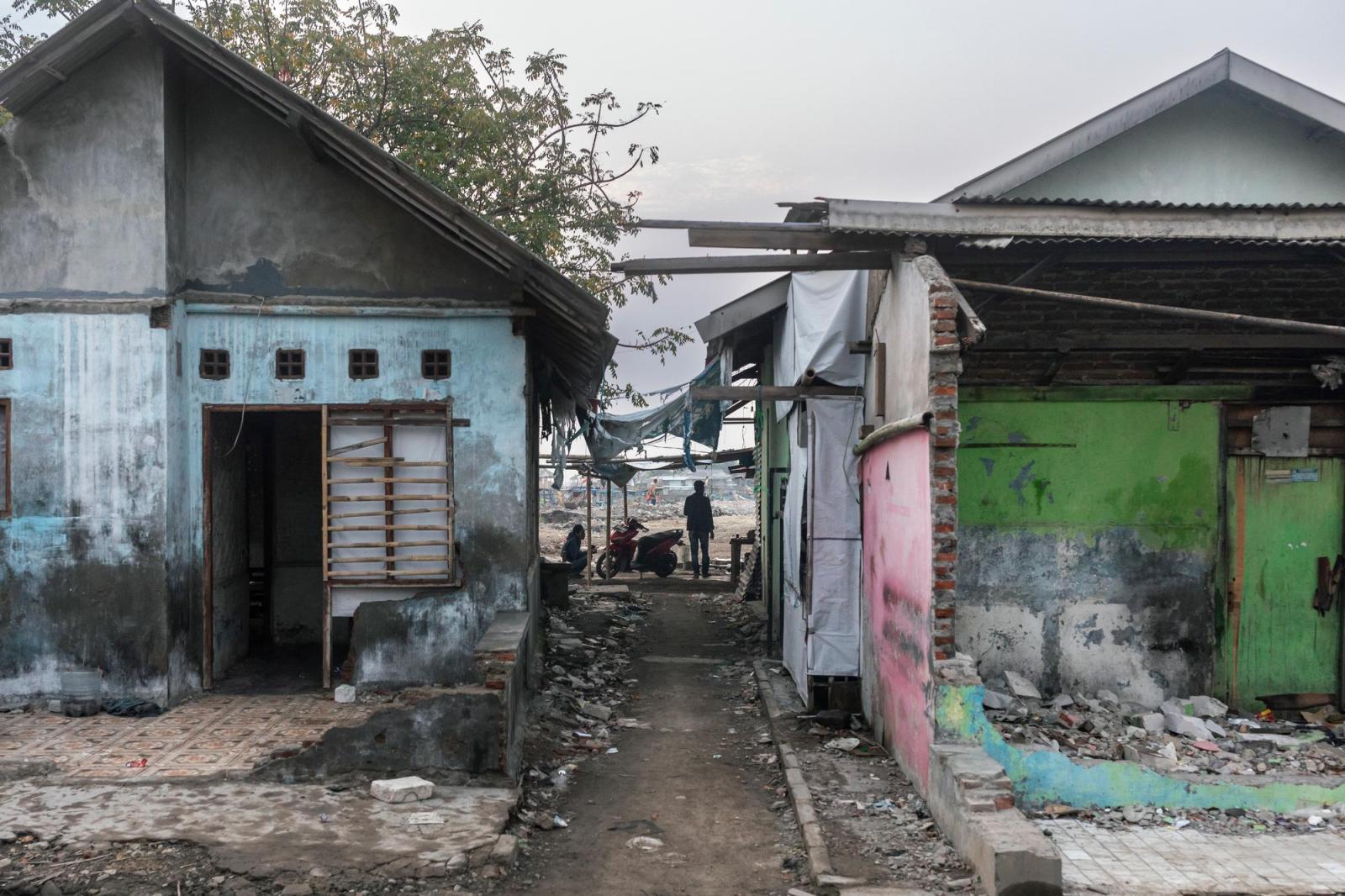 Destroyed homes in an informal settlement in Indonesia.