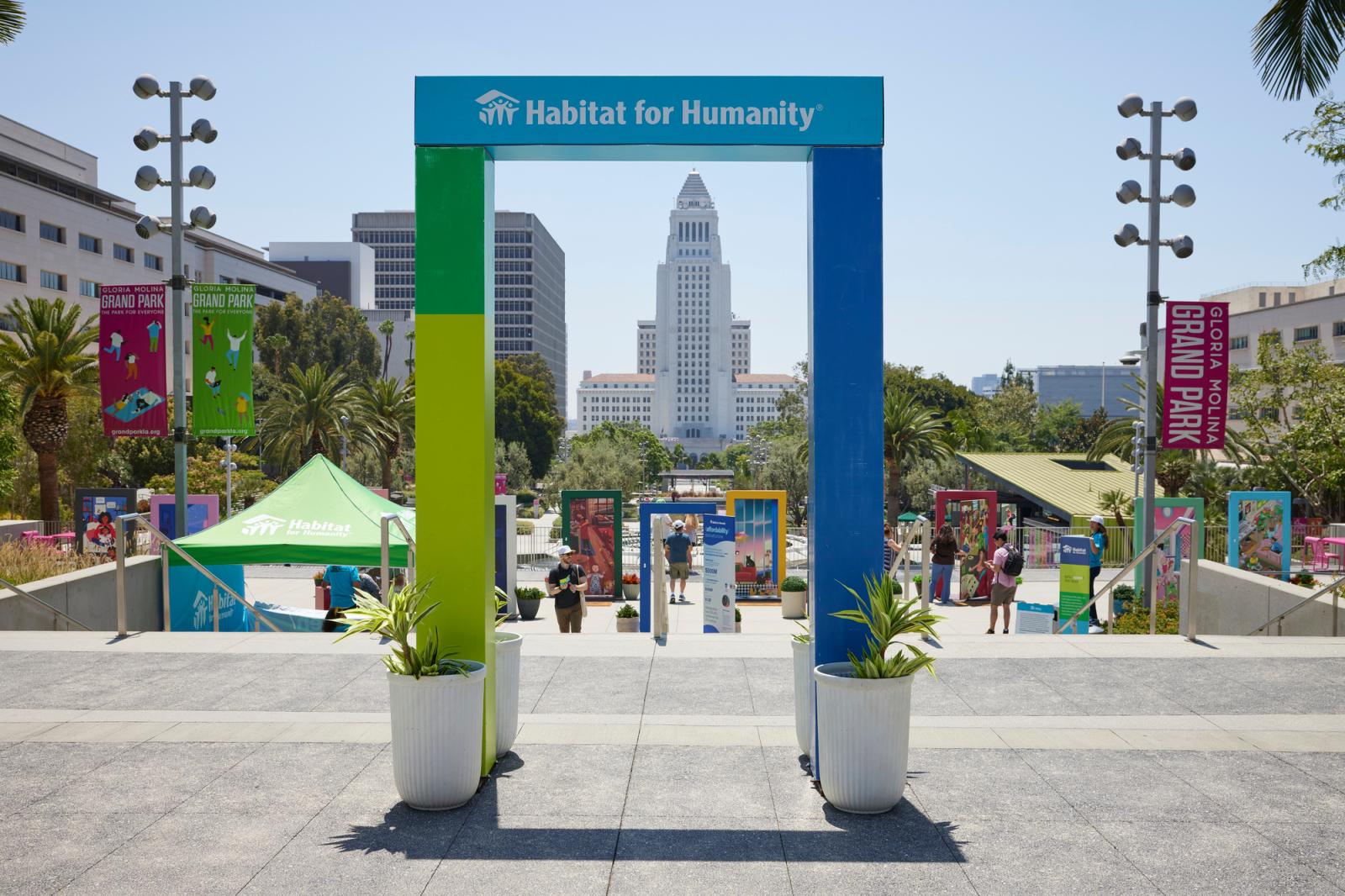 The archway at the beginning of the door exhibit with the LA skyline in the background.