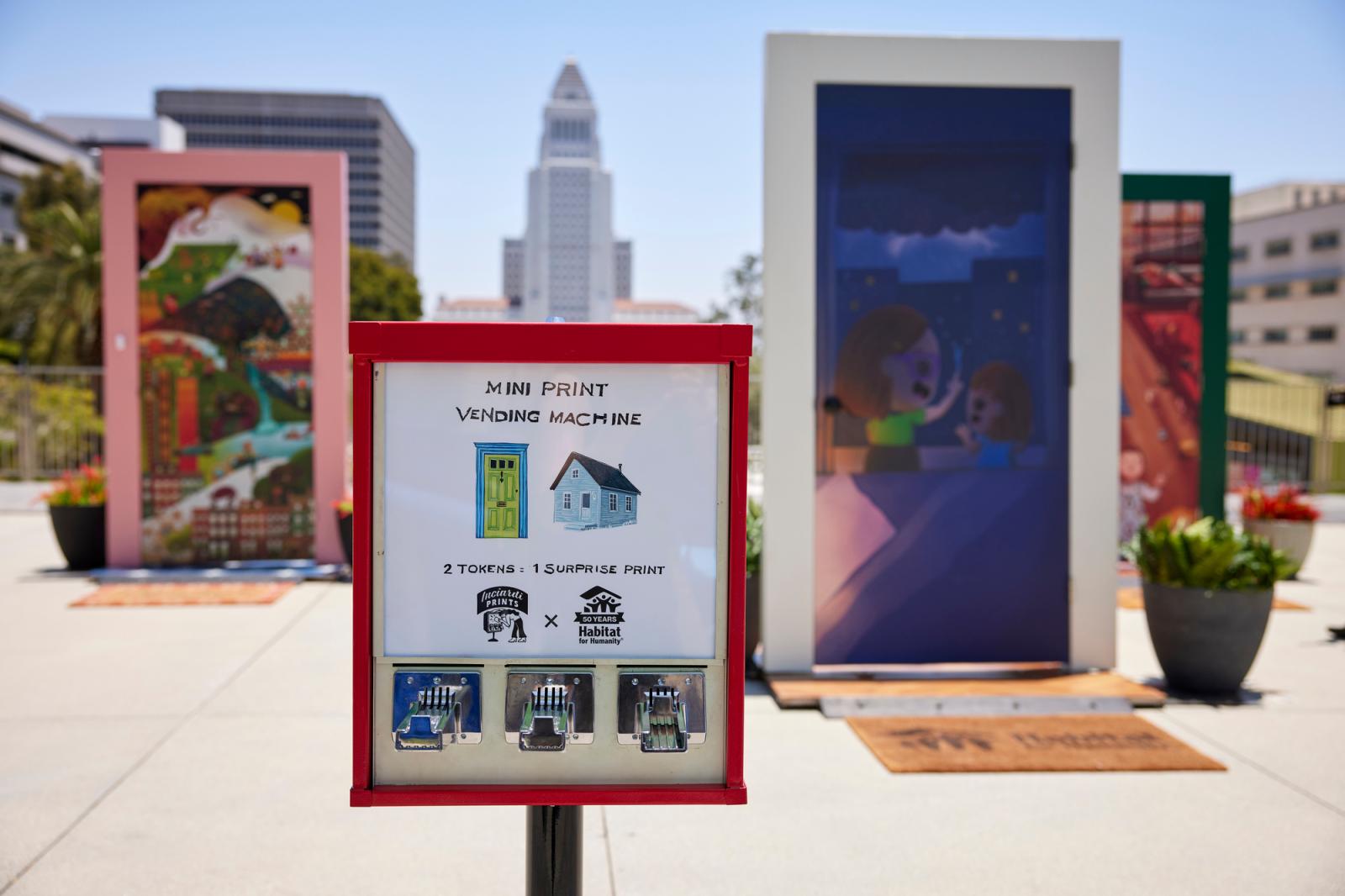 Mini print vending machine with the door exhibit in the background. 