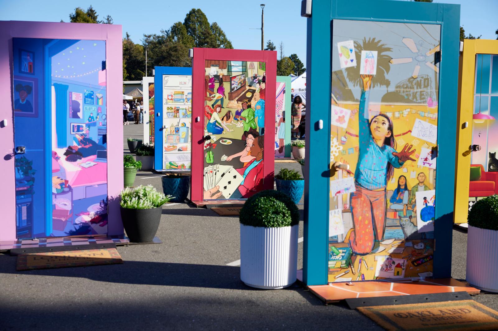 Multiple illustrated doors as part of the Let's Open the Door pop-up event.