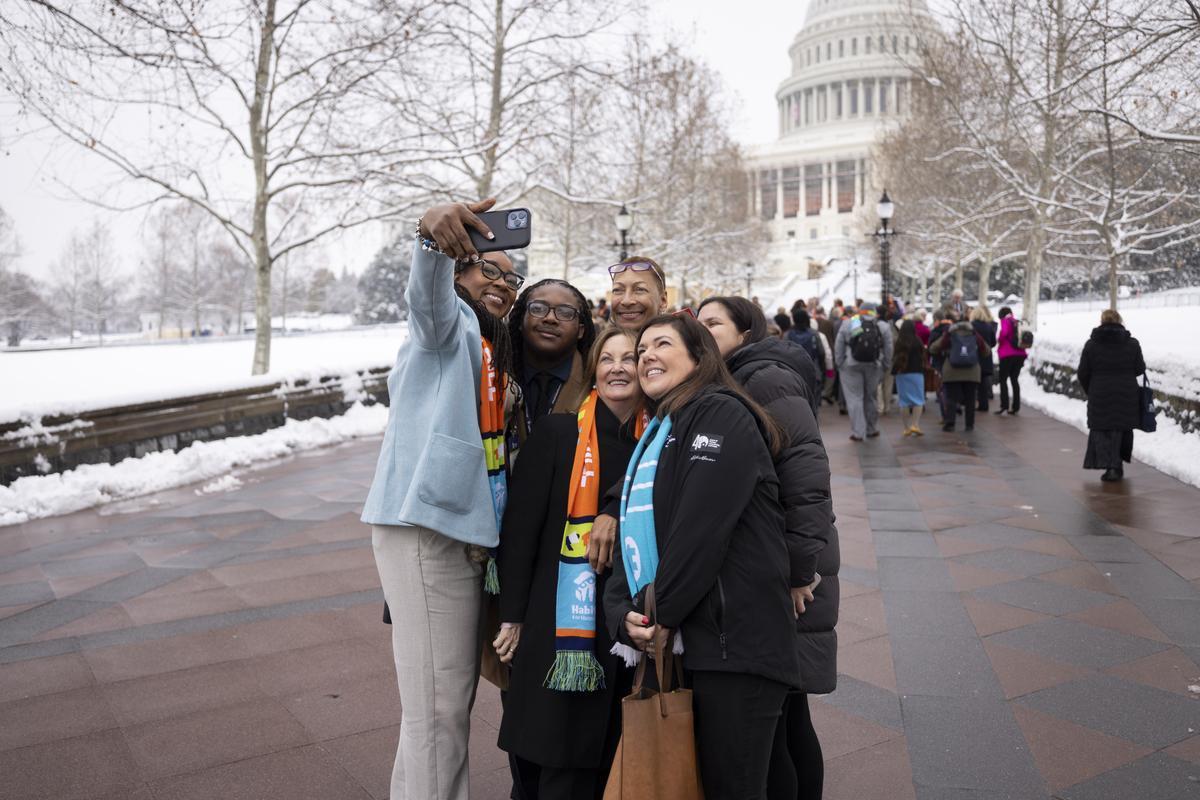 Members of the North Carolina delegation pose of a portrait in front of the Capitol.