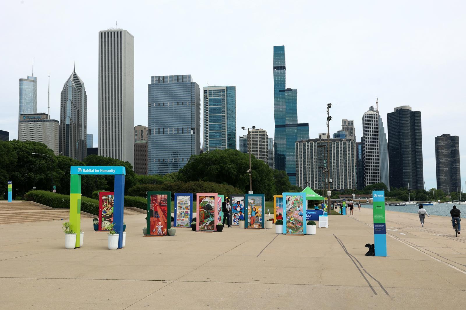 Wide shot of the digital doors exhibit with the Chicago skyline in the background.