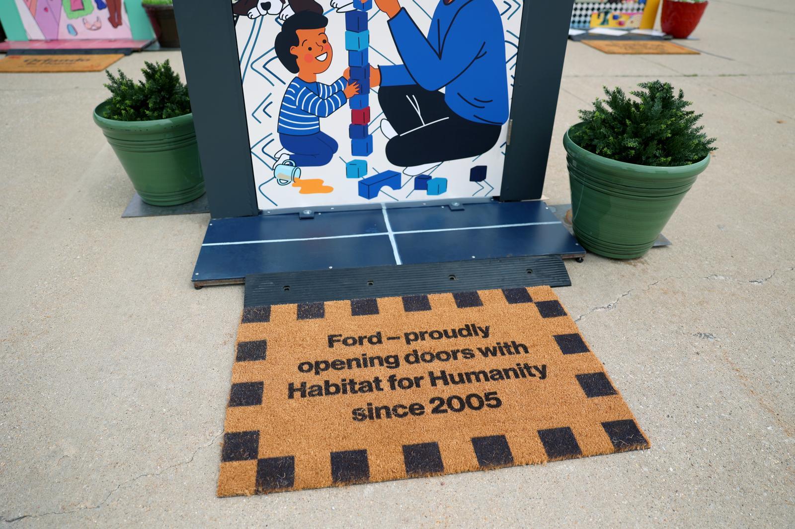 Doormat that says, "Ford proudly opening doors with Habitat for Humanity since 2005."