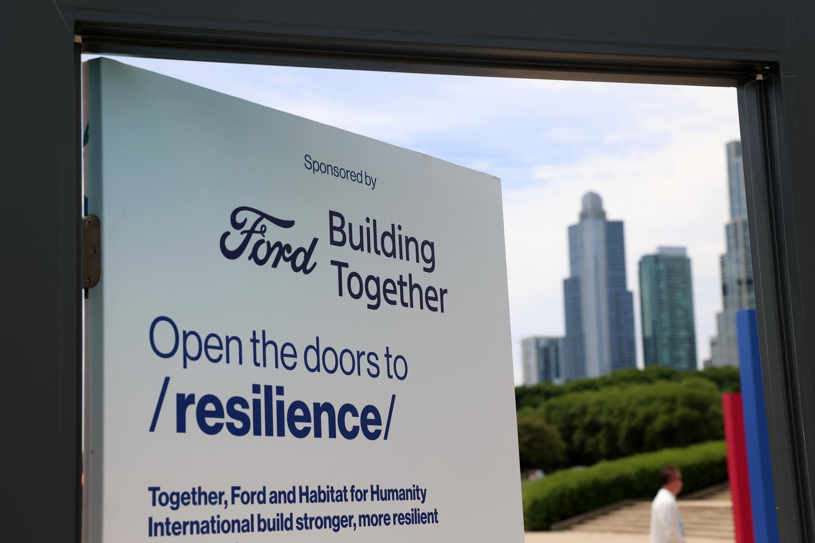 A door that says "Ford building together. Open the doors to resilience."