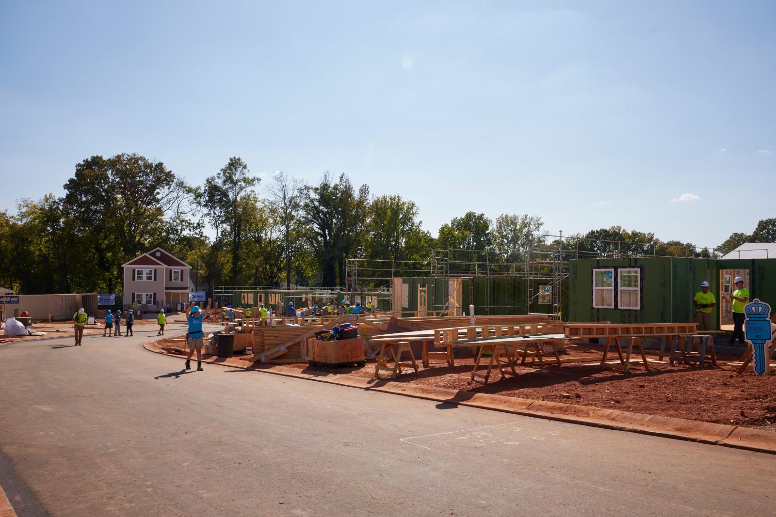 A photo of an early build site, some walls are erected.