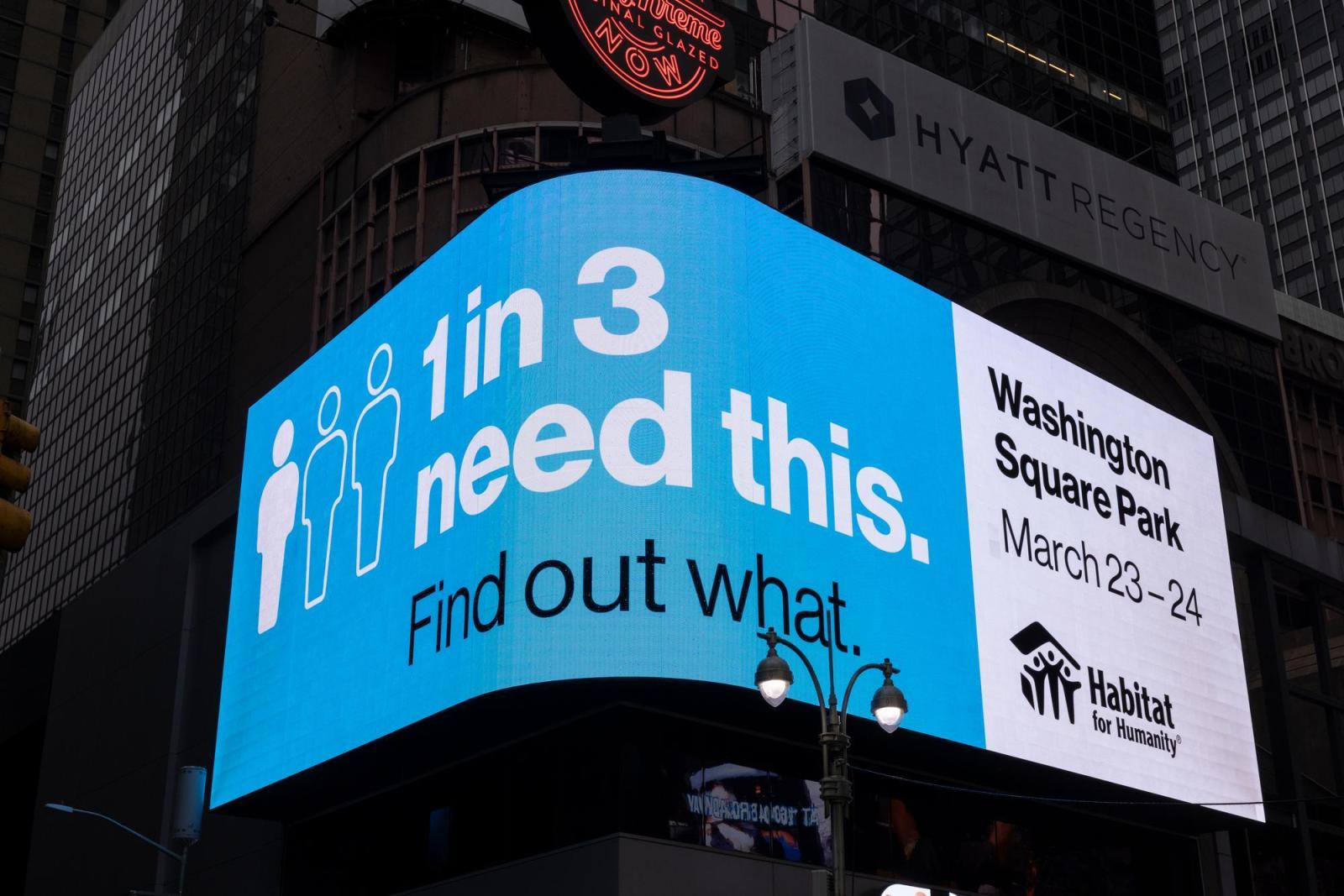 Digital advertisement in Times Square that reads 1 in 3 people need this, find out what.