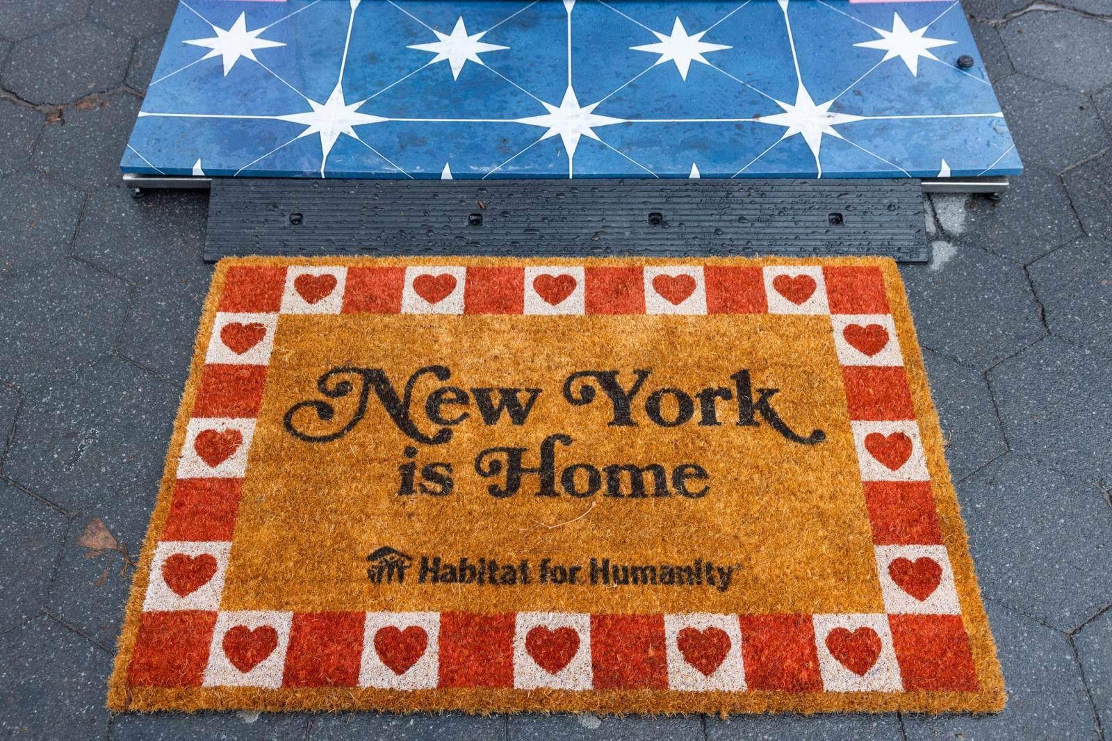 Doormat that says "New York is Home" Habitat for Humanity.