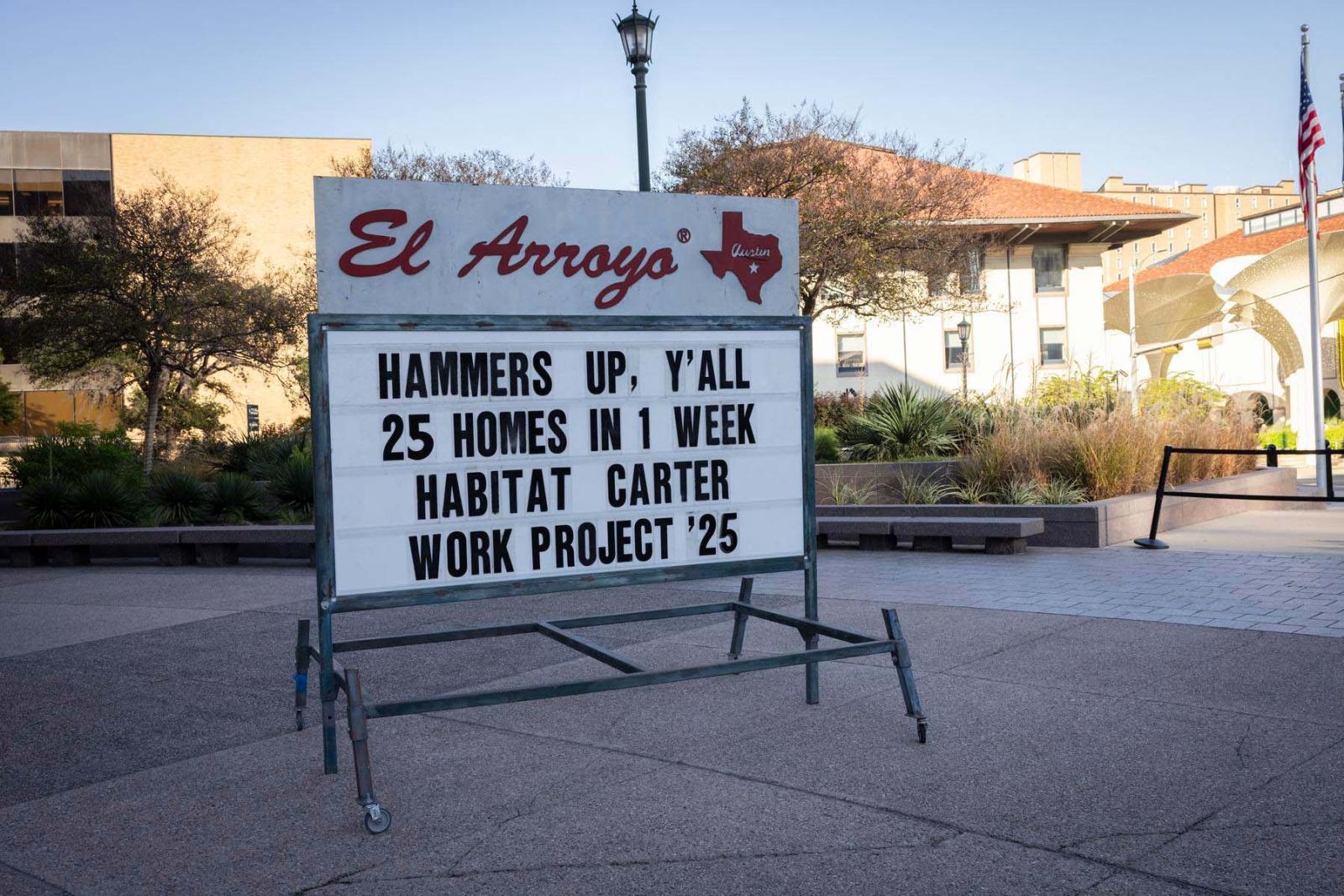  The famous El Arroyo sign in Austin displays a message reading, “Hammers up y’all. 25 homes in 1 week. Habitat Carter Work Project ‘25.”