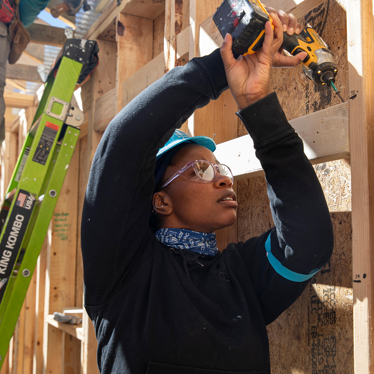 Carter Work Project volunteer using an electric screwdriver. 