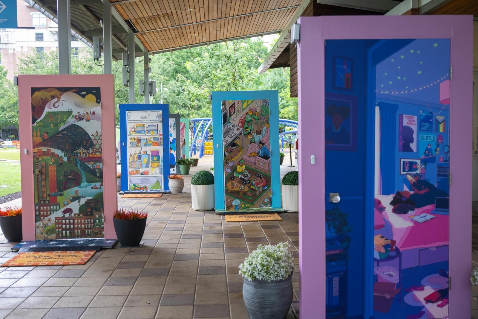 Four illustrated doors with purple, peach, teal and blue door frames. 