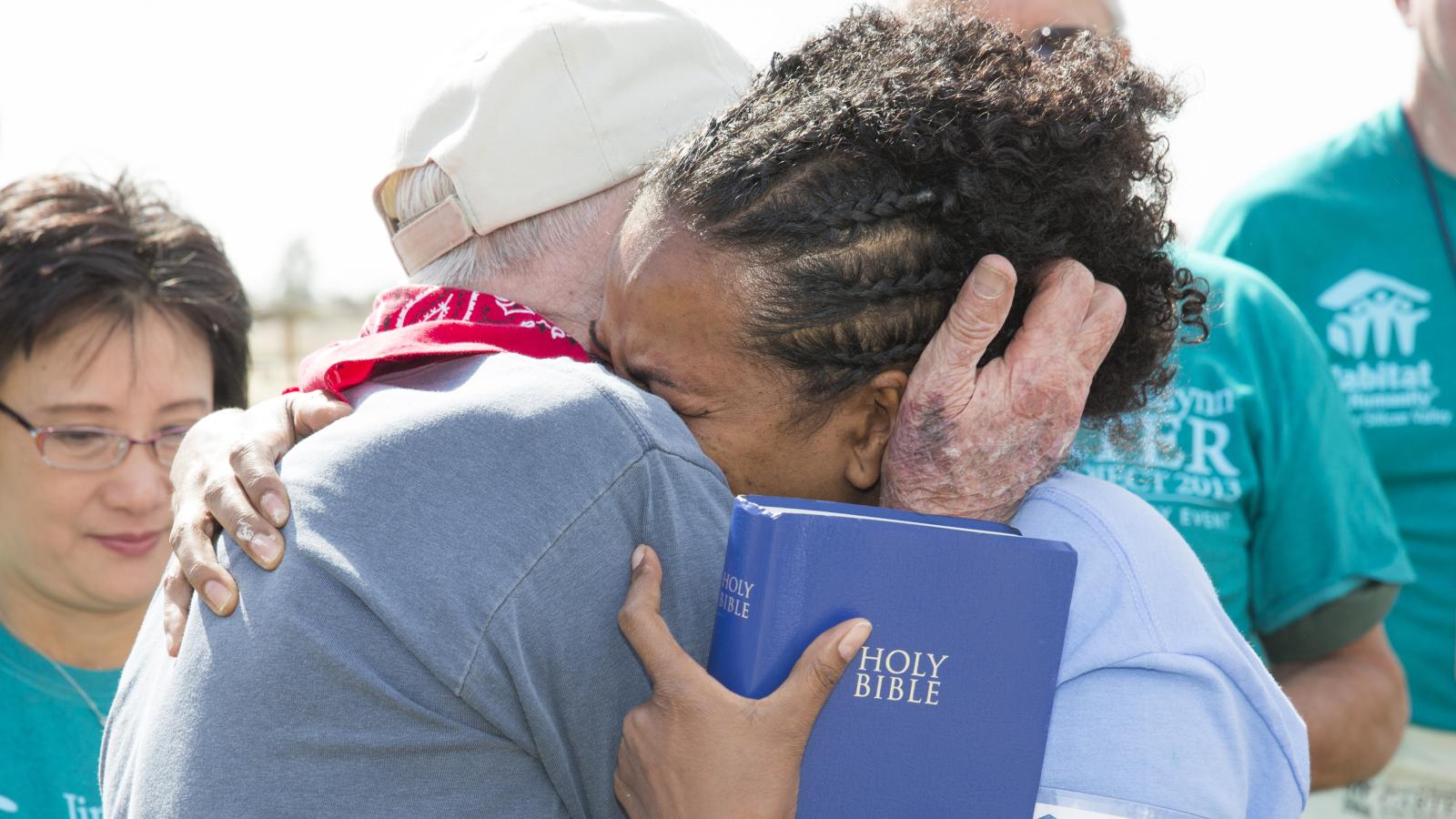 Jimmy Carter and Semira in an emotional embrace