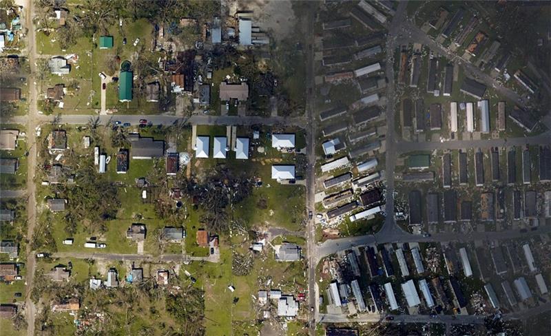 Five Habitat For Humanity houses, center, stood firm during Hurricane Michael even as an adjacent trailer park saw heavy damage. (National Oceanic and Atmospheric Administration)