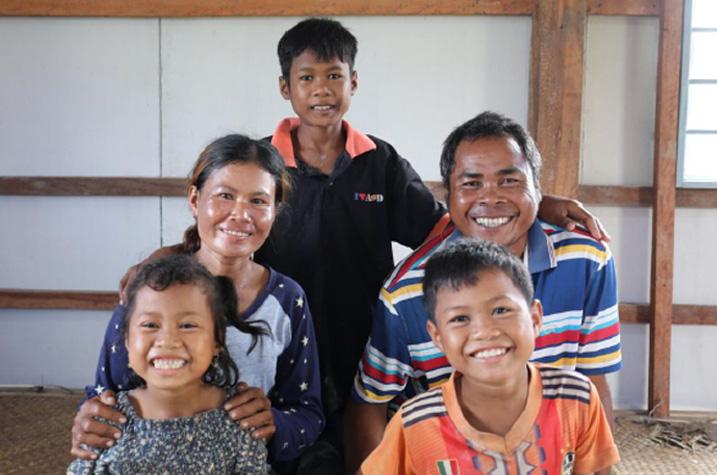 Family of 5 in house built by Habitat Cambodia.