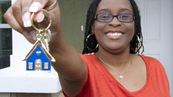 New homeowner holds house keys