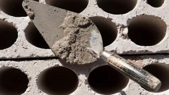 Trowel with cement and bricks